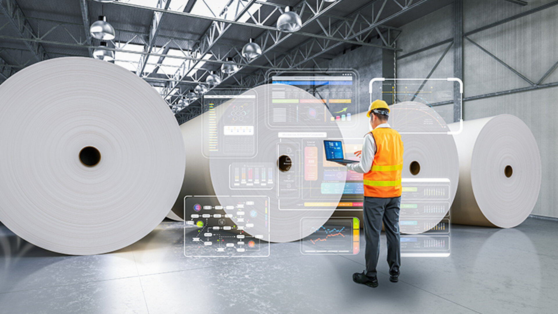 Die Digitalisierung wirkt sich auf immer mehr Prozesschritte der Papierproduktion aus und ermöglicht eine effizientere Herstellung – u. a. hinsichtich Energie, Kosten und Material. In einer Lagerhalle sind zwischen einem Laptop-haltenden Ingenieur einer Papierfabrik und fertig produzierten Papierrollen überdimensionale Einblendungen digitaler Charts zu sehen.